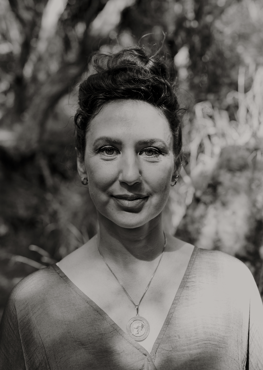 Black and white close-up portrait of Ivana smiling softly